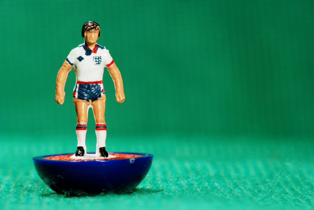 Pila, Italy - May 26, 2011: Vintage Subbuteo miniature toy of a soccer player of the English national team. Subbuteo is a set of table top games simulating team sports such as soccer, cricket, rugby and hockey created by Peter Adolph.